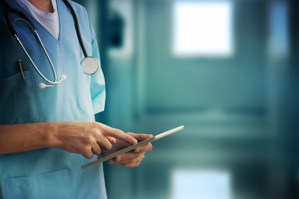 Medical professional using a tablet